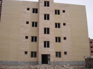The project includes 18 blocks and 263 four - storey residential units in the Khajoo town of Kerman .